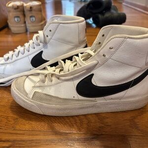 Nike White High-Top Sneakers with Black Swoosh